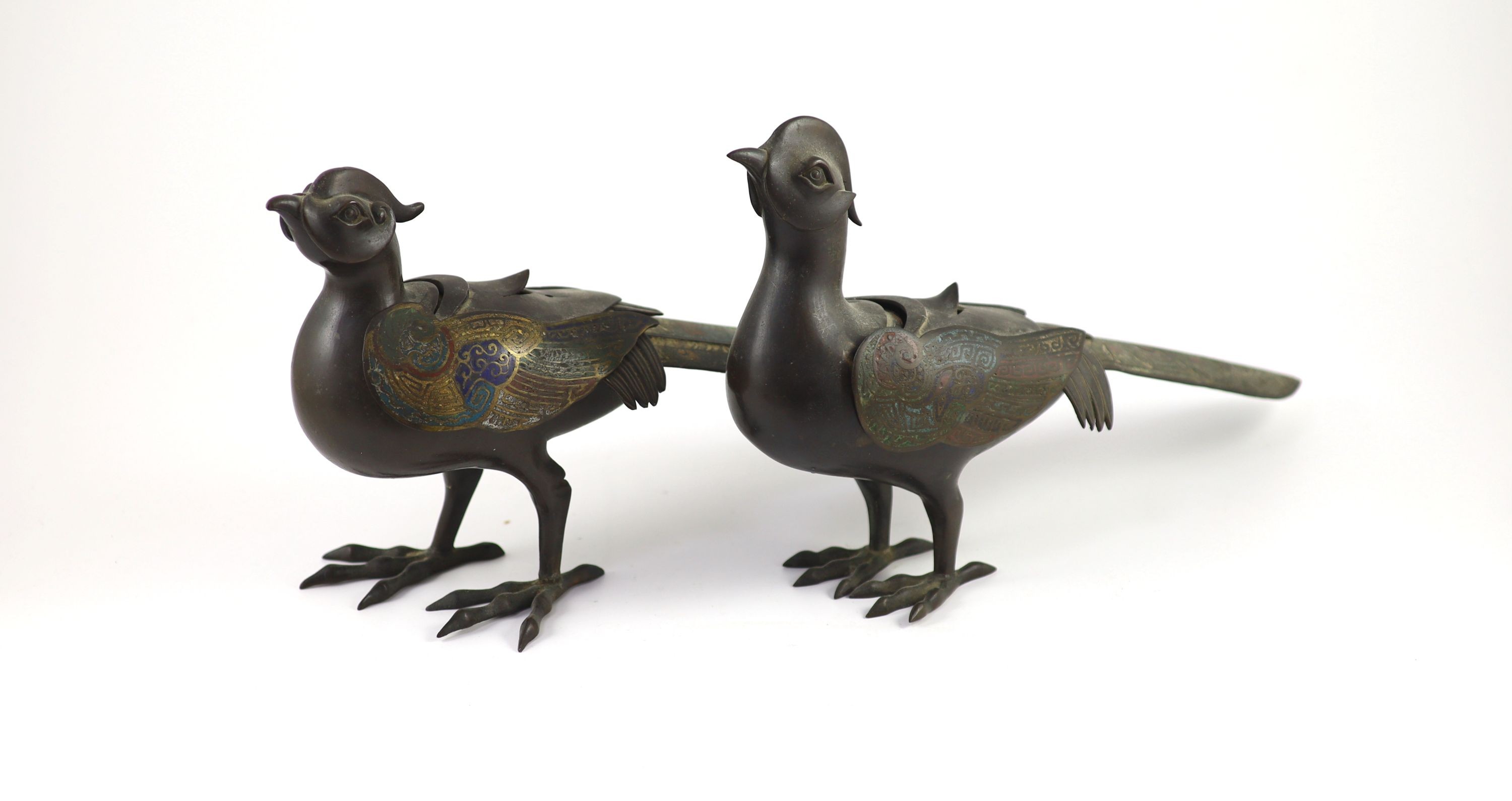 Two similar Japanese champlevé enamel and bronze ‘pheasant’ censers and covers, Meiji period, 39 cm long